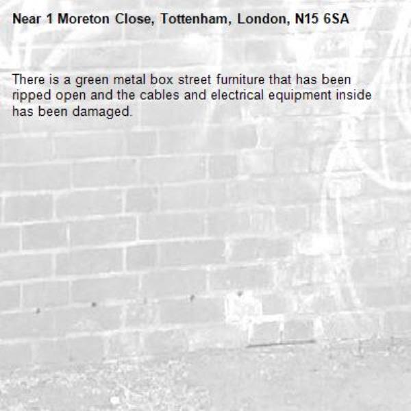 There is a green metal box street furniture that has been ripped open and the cables and electrical equipment inside has been damaged.-1 Moreton Close, Tottenham, London, N15 6SA
