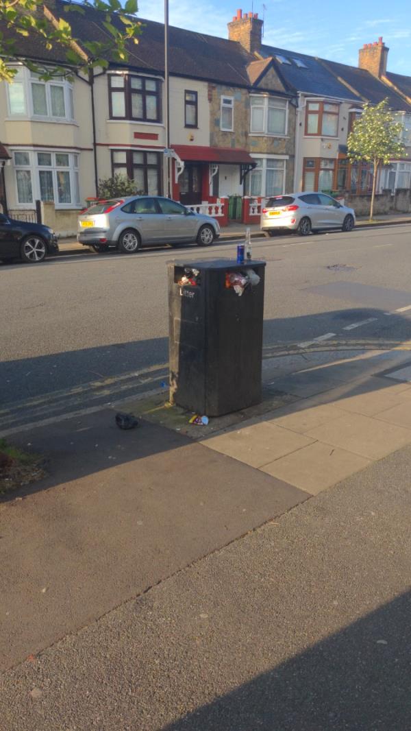 Bin over flowing outside launderette on the corner of Mafeking Ave and Central Park Rd -149 Central Park Road, East Ham, London, E6 3DJ