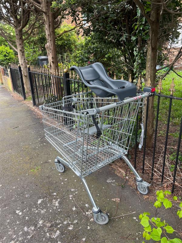 Trolley with baby seat on corner of Dorville Road and Rose Way SE12-90 Dorville Road, London, SE12 8DR