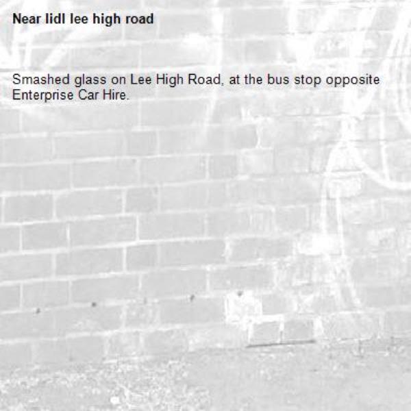 Smashed glass on Lee High Road, at the bus stop opposite Enterprise Car Hire.-lidl lee high road