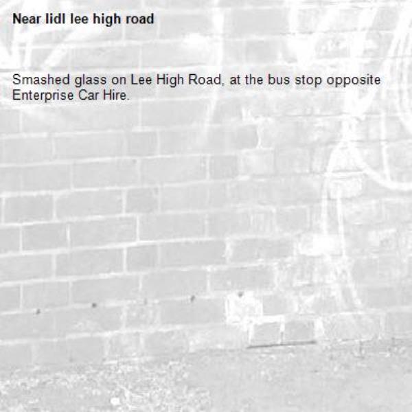 Smashed glass on Lee High Road, at the bus stop opposite Enterprise Car Hire.-lidl lee high road