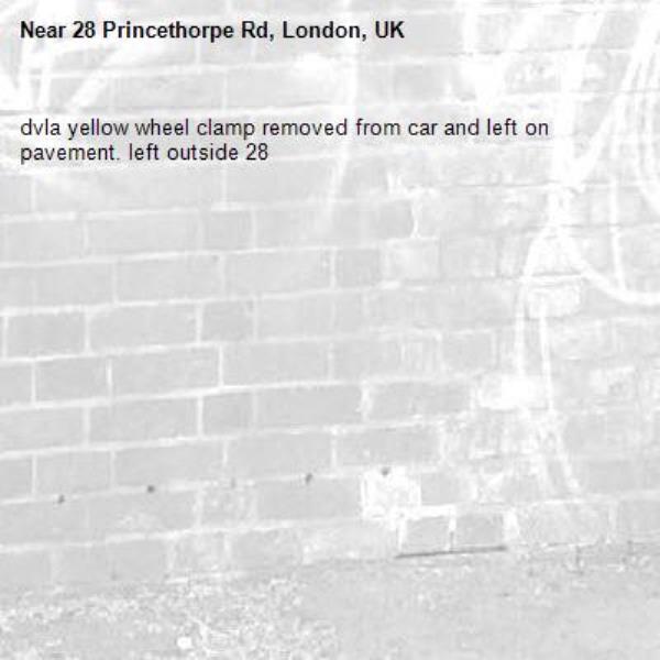 dvla yellow wheel clamp removed from car and left on pavement. left outside 28-28 Princethorpe Rd, London, UK