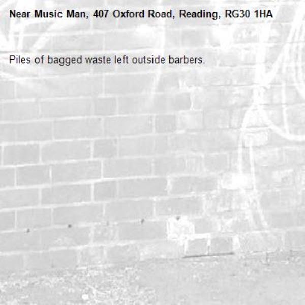 Piles of bagged waste left outside barbers.-Music Man, 407 Oxford Road, Reading, RG30 1HA