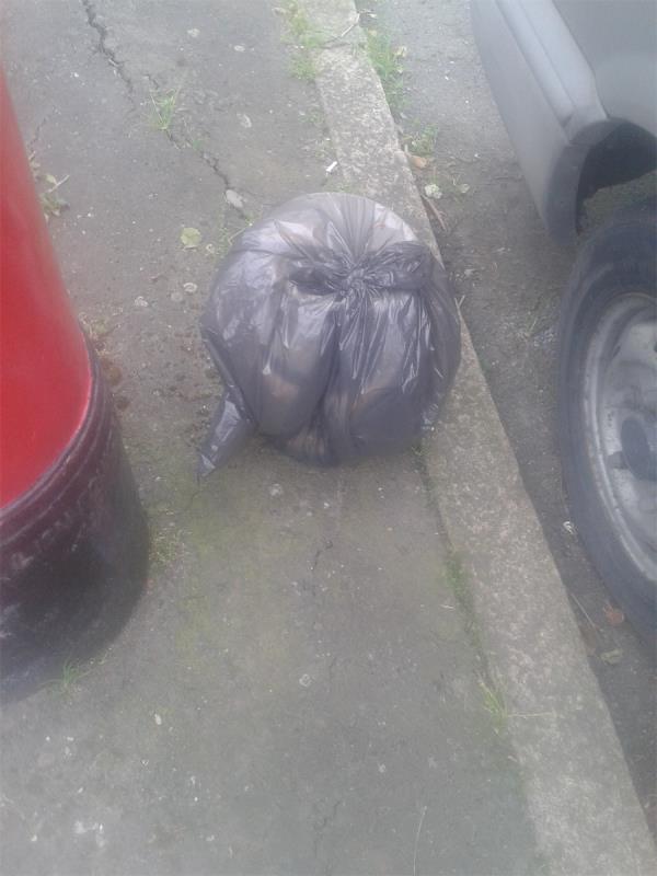 Outside St Barnabas Church by post box. Please clear a black bag-154 Downham Way, Bromley, BR1 5NT