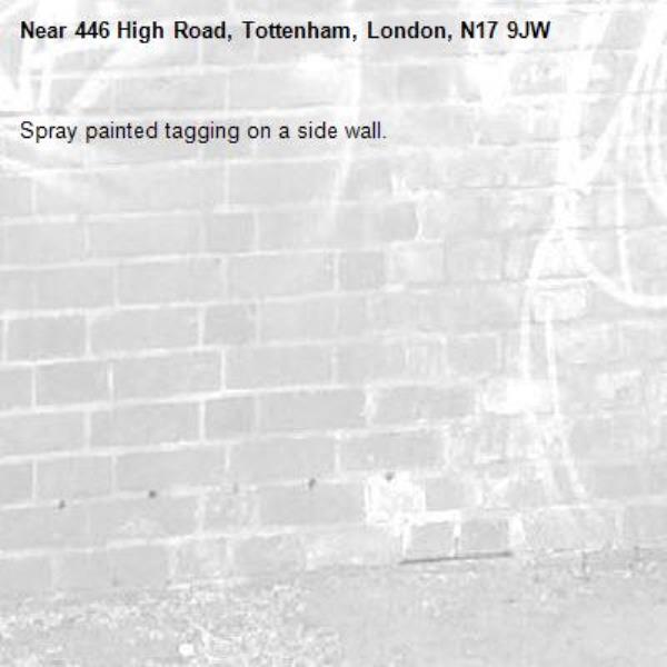 Spray painted tagging on a side wall.-446 High Road, Tottenham, London, N17 9JW
