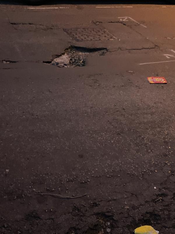 This is a urgent pot hole! Please can this be fixed! This is ah urgent request! How can one drive! Massive deep pot hole! Please pass to highways team! This is causing major delays!-Park Lodge Woodhouse Grove, Manor Park, E12 6SR