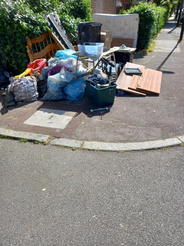 Household items and rubbish left on pathway outside flats-45A, Alverton Street, London, SE8 5NH
