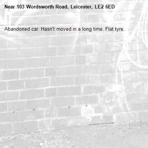 Abandoned car. Hasn't moved in a long time. Flat tyre.-103 Wordsworth Road, Leicester, LE2 6ED