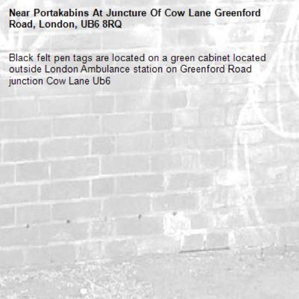 Black felt pen tags are located on a green cabinet located outside London Ambulance station on Greenford Road junction Cow Lane Ub6 -Portakabins At Juncture Of Cow Lane Greenford Road, London, UB6 8RQ