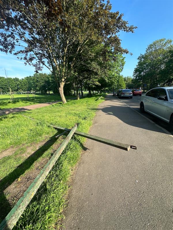 Travellers in Beckton Park intentionally damaged Park barrier and left it dangerously on pavement. Please remove it to prevent an accident. -Beckton District Park