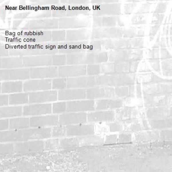 Bag of rubbish
Traffic cone
Diverted traffic sign and sand bag-Bellingham Road, London, UK
