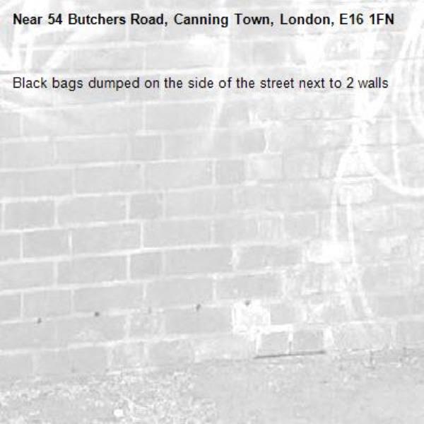 Black bags dumped on the side of the street next to 2 walls-54 Butchers Road, Canning Town, London, E16 1FN