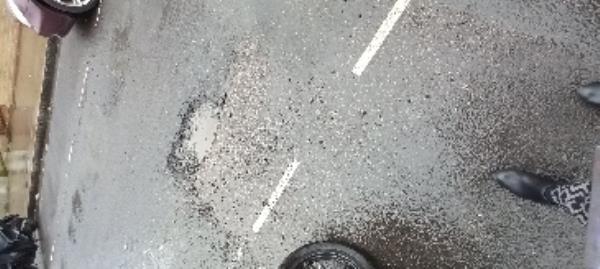 pothole in middle of road near 14 St Martins Avenue E6 3DX-14 St Martins Avenue, East Ham, London, E6 3DX