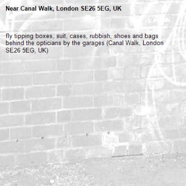 fly tipping boxes, suit, cases, rubbish, shoes and bags
behind the opticians by the garages (Canal Walk, London SE26 5EG, UK)-Canal Walk, London SE26 5EG, UK