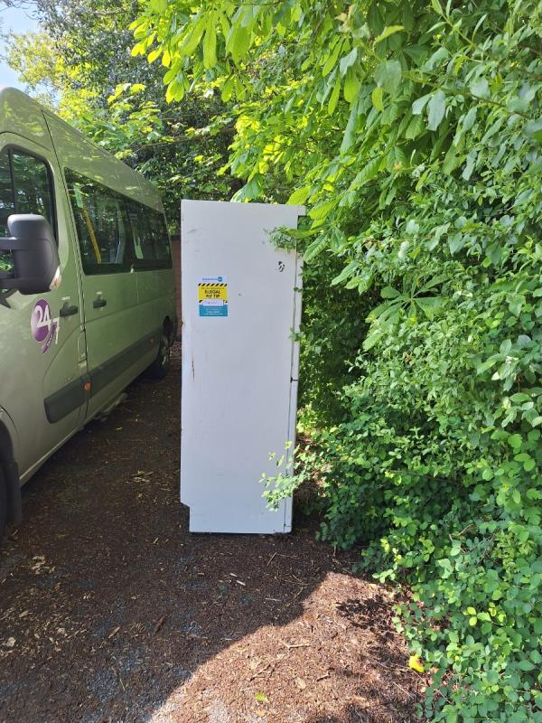 Tall white fridge/freezer in car park to the left near hedge line.-Orkney Court, Rockhurst Drive, Eastbourne, BN20 8UR