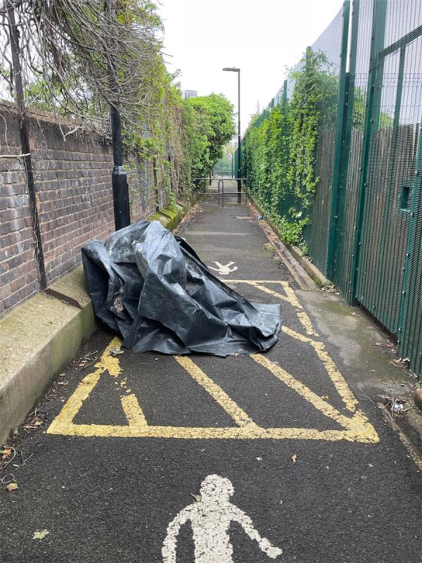 Large black sheet in alley way between east road and46  park road e16-56 East Road, Stratford, London, E15 3QR