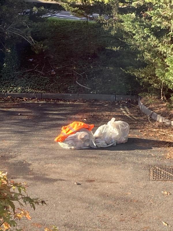 Abandoned rubbish along with high vis clothing. -168 Farnborough Road, Knellwood, GU14 7JJ, England, United Kingdom