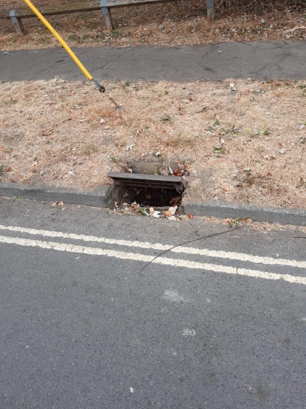 Raised/ open drain cover in kurb along grass verge. Appears to be wedged open.-12 Broomdashers Road, Crawley, RH10 1PT