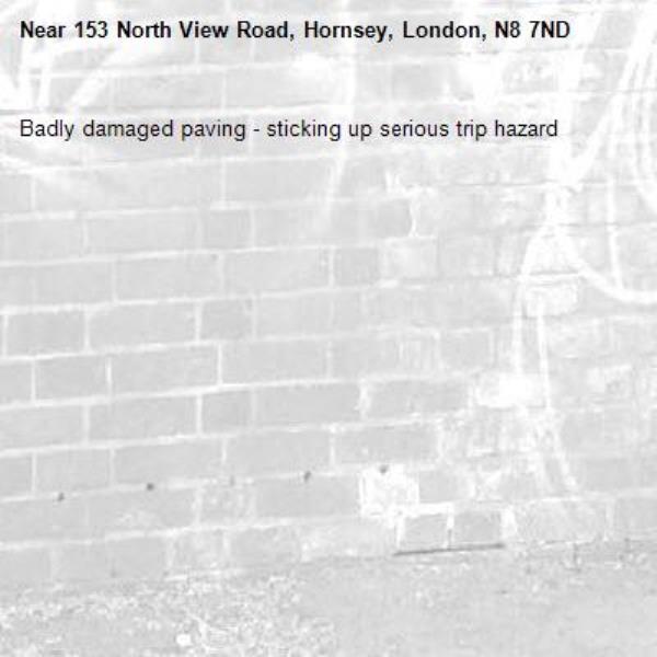 Badly damaged paving - sticking up serious trip hazard-153 North View Road, Hornsey, London, N8 7ND