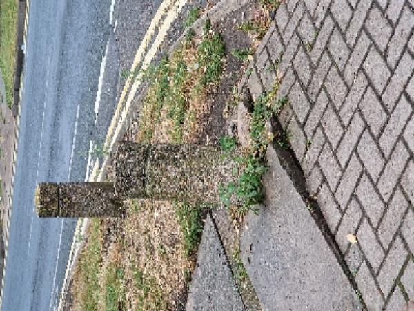 A vehicle has hit the bollard which is on the footpath at the junction of Ethel Rd and Clovelly Rd. It has raised the paving slab to a dangerous level.-163 Ethel Road, Leicester, LE5 4WA