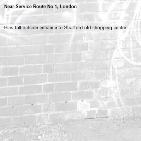 Bins full outside entrance to Stratford old shopping centre -Service Route No 1, London