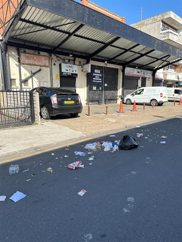 Burst discarded bags and litter and rotting food on road -11 Westbury Road, Forest Gate, London, E7 8BU