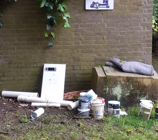 Several tins of paint, plumbing materials, carpet etc dumped.-81 Pagoda Gardens, Blackheath, London, SE3 0UZ