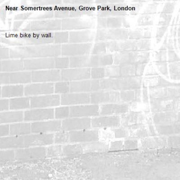 Lime bike by wall. -Somertrees Avenue, Grove Park, London