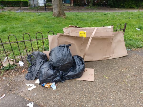 Cardboard boxes and bags of household waste fly tipped at junction of 38 Liddon Road and Balaam Street, E13. -38 Liddon Road, Plaistow, London, E13 8AN