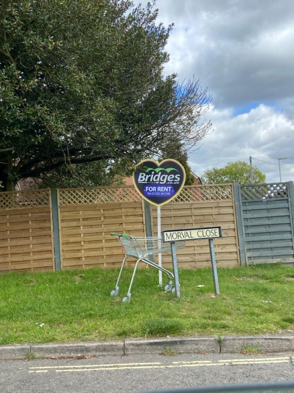 Abandoned Asda Shopping trolley by Morval Close roadsign-Toby Cottage, 69 Southwood Road, Farnborough, GU14 0JH