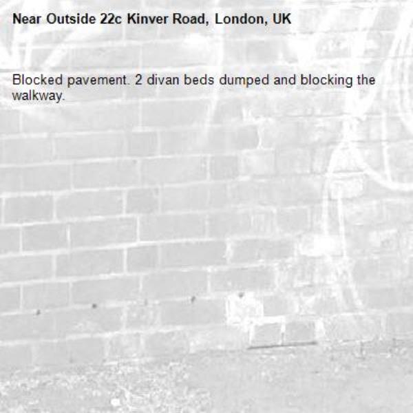 Blocked pavement. 2 divan beds dumped and blocking the walkway.-Outside 22c Kinver Road, London, UK