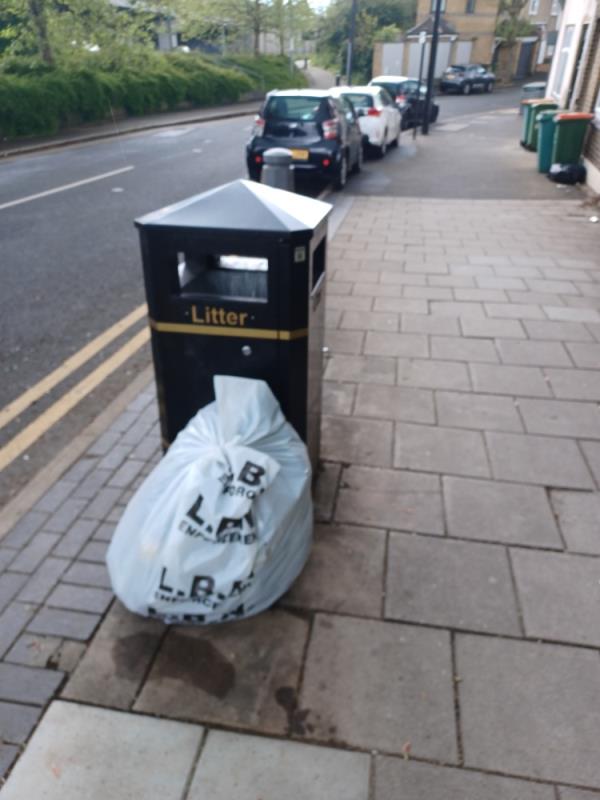 Bags of building waste fly tipped next to LBN litter bin at 4 Roman Road, E6.-4 Roman Road, East Ham, London, E6 3RX
