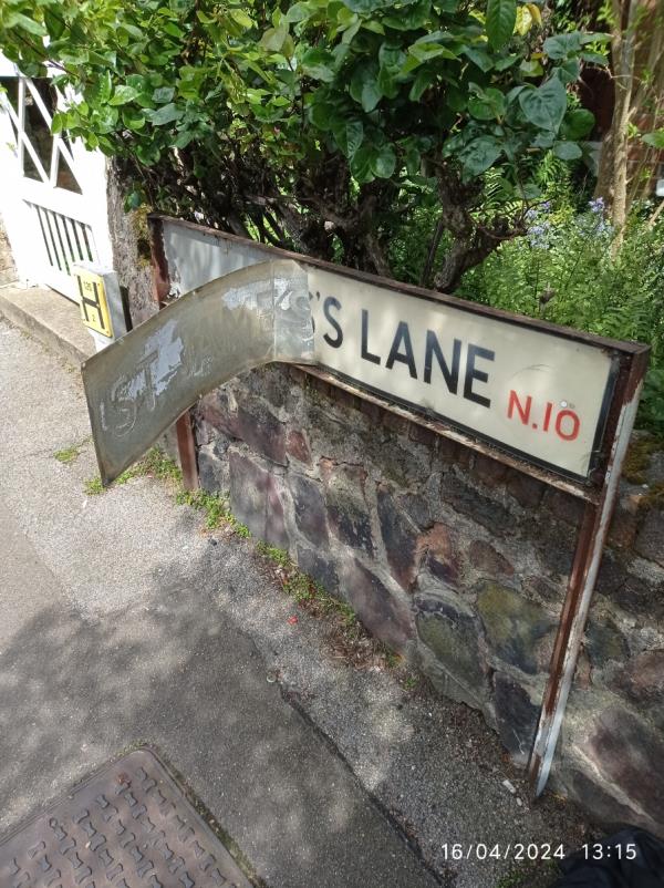 Street sign outside 1 St James' Lane damaged.-5 St James's Lane, Hornsey, London, N10 3DA