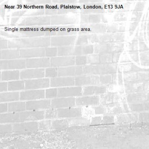 Single mattress dumped on grass area. -39 Northern Road, Plaistow, London, E13 9JA
