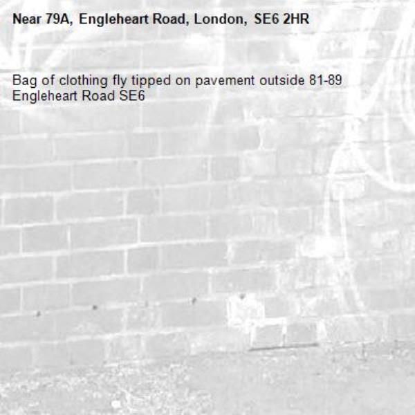 Bag of clothing fly tipped on pavement outside 81-89 Engleheart Road SE6 -79A, Engleheart Road, London, SE6 2HR