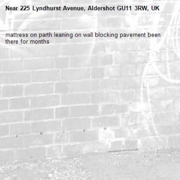 mattress on parth leaning on wall blocking pavement been there for months -225 Lyndhurst Avenue, Aldershot GU11 3RW, UK