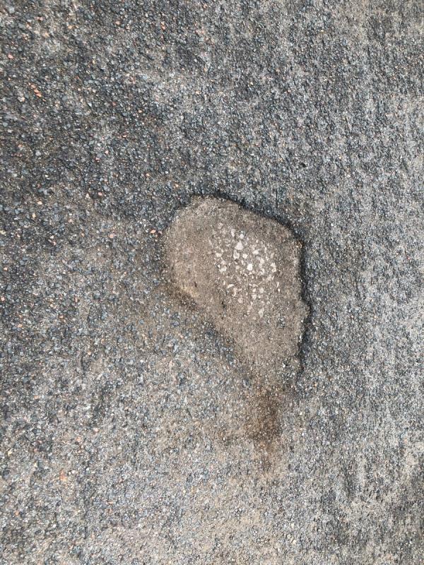 Please repair pot hole in road way-47 Persant Road, London, SE6 1RX