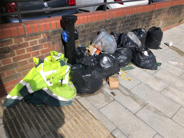 Opposite Creekside Centre. Please cllear pile of bags-Creekside, London
