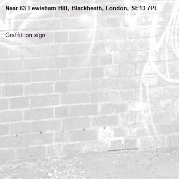 Graffiti on sign-63 Lewisham Hill, Blackheath, London, SE13 7PL