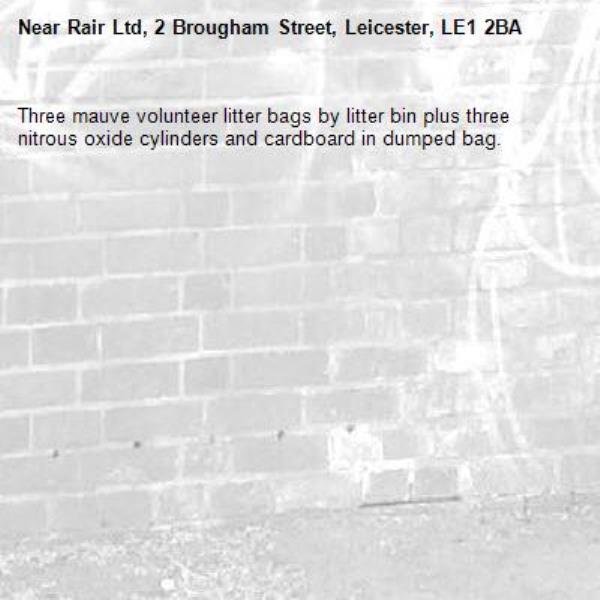 Three mauve volunteer litter bags by litter bin plus three nitrous oxide cylinders and cardboard in dumped bag.-Rair Ltd, 2 Brougham Street, Leicester, LE1 2BA