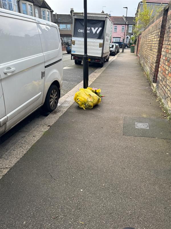 Yellow rubbish bags dumped. -19 Inniskilling Road, Plaistow, London, E13 9LD