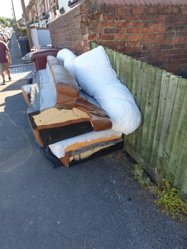 A sofa which was dumped about 2 weeks ago has been pulled apart and landed on the other side of the road. It's an eyesore. -651 Oxford Road, Reading, RG30 1HP