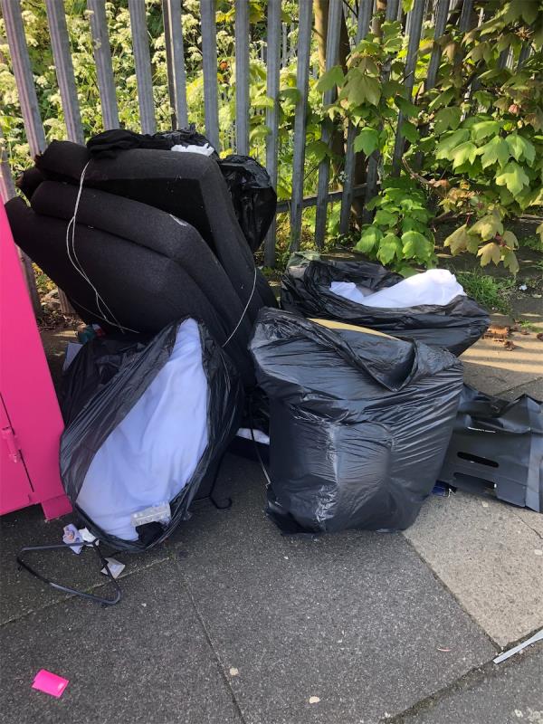 Please clear bags from side of clothing bank-Vital N R G, Bellingham Railway Station, Randlesdown Road, Bellingham, London, SE6 3BT