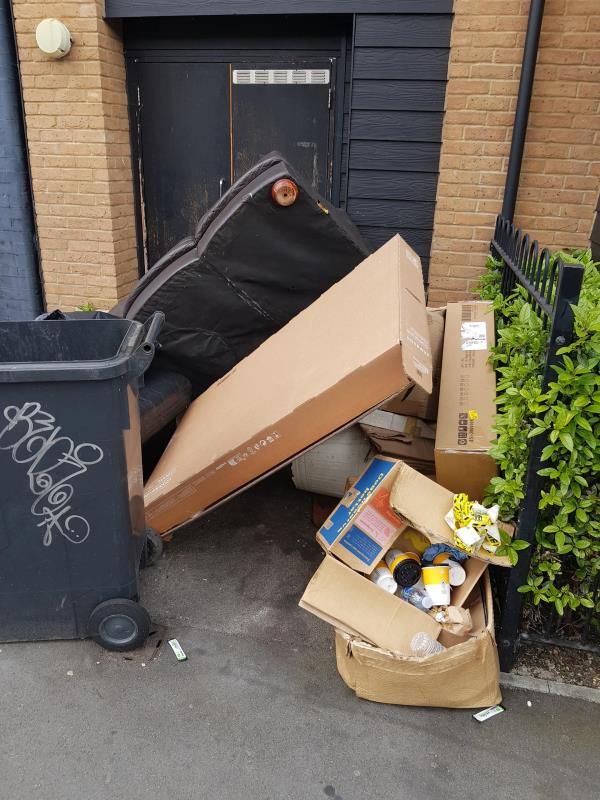 Furniture and other rubbish seen being dumped outside bin cupboard for 55 Sangley Road by people from 53B Sangley Road this afternoon.-55 Sangley Road