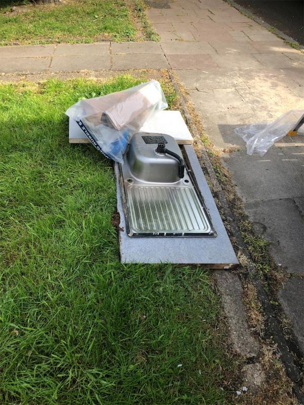 66-76. Please clear a sink and other waste from grass area-66 Swiftsden Way, Bromley, BR1 4NT