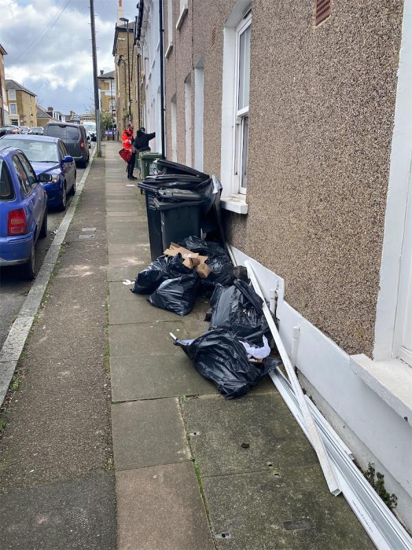 Number 11 Residents over flowing bins. Broken black bags spilling all over the pavement, dirty nappies. -11 Vulcan Road, London, SE4 1DQ