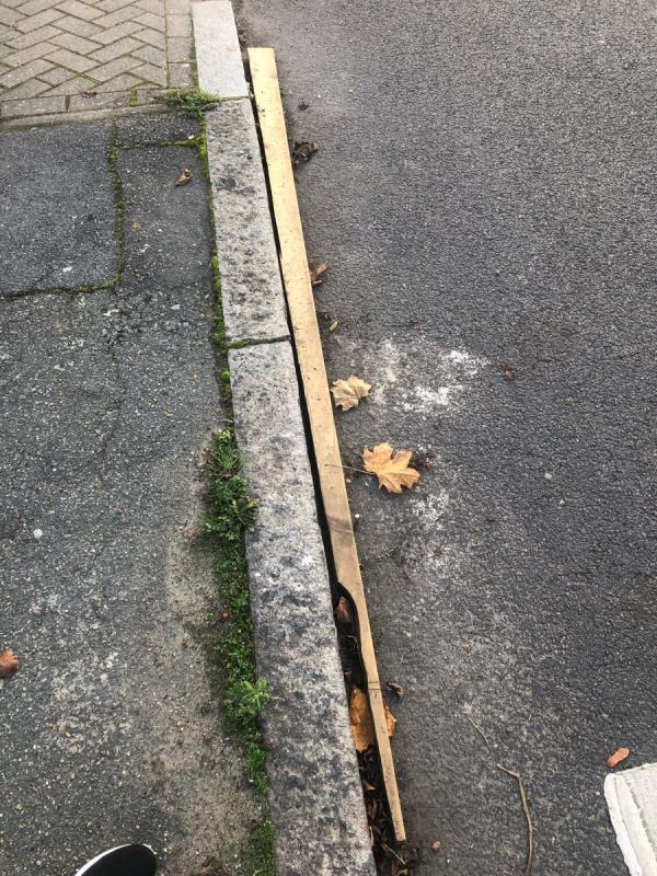 A piece of long wood still left by road side -67 Riverview Park, Catford, SE6 4PL, England, United Kingdom