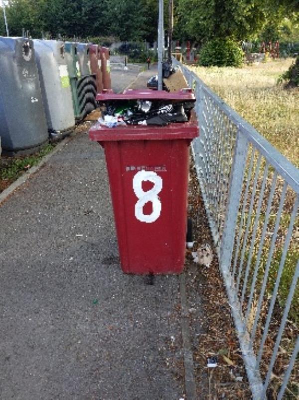 abandoned red bin left by recycling site-86 George Street, Reading, RG1 7NT