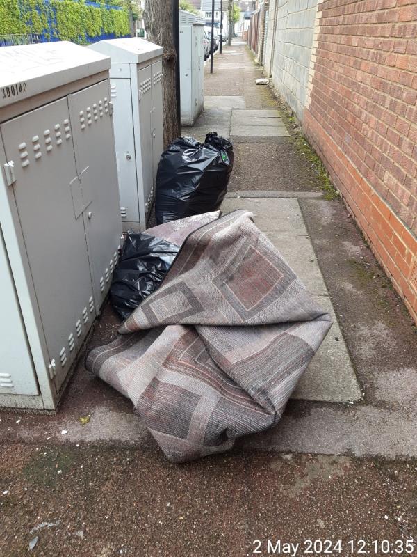 carpet and bags dunped adjacent 41 fourth ave E12 , no evidence within -84 Fourth Avenue, Manor Park, London, E12 6DR