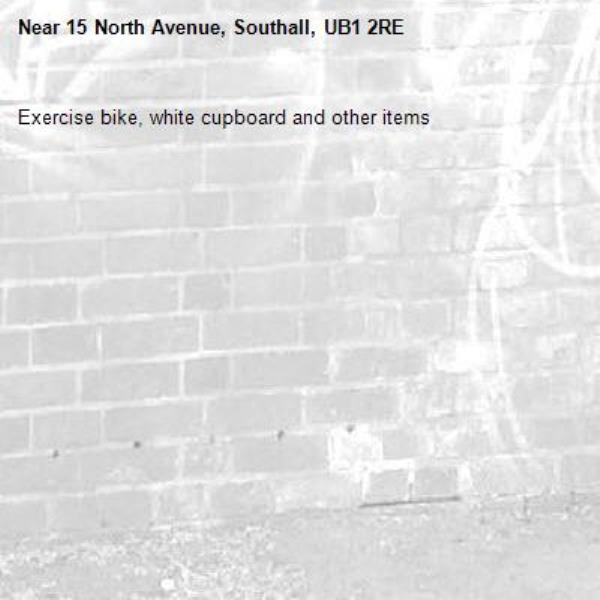 Exercise bike, white cupboard and other items-15 North Avenue, Southall, UB1 2RE